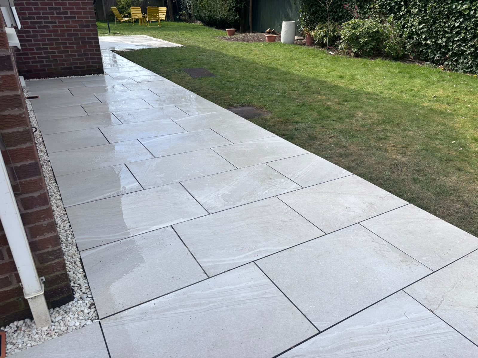 Modern porcelain paved patio installed by Stonecoat Driveways